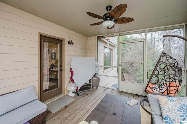 sunroom / solarium with ceiling fan