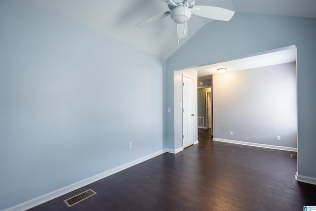 empty room featuring dark hardwood / wood-style flooring, vaulted ceiling, and ceiling fan