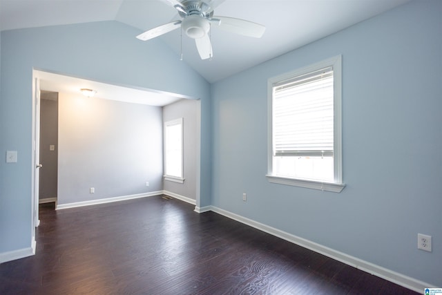 empty room featuring ceiling fan, dark hardwood / wood-style floors, and lofted ceiling