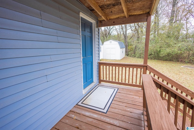 wooden terrace featuring a storage unit