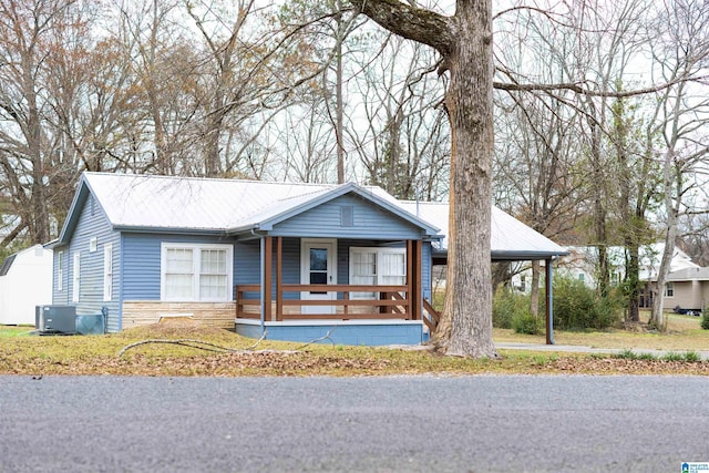 view of front of house featuring covered porch and central air condition unit