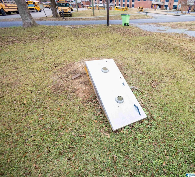 view of storm shelter featuring a yard