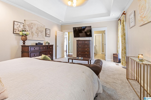 bedroom with a tray ceiling, light carpet, and ornamental molding