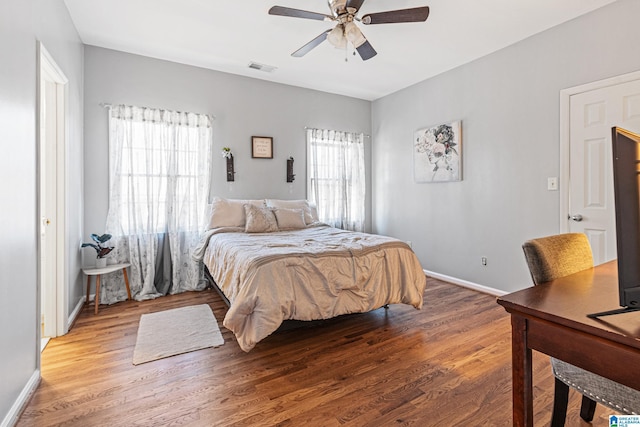 bedroom with ceiling fan and wood-type flooring