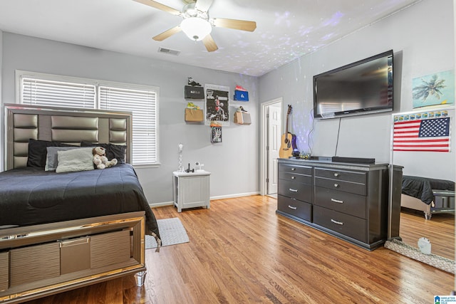 bedroom featuring light hardwood / wood-style flooring and ceiling fan