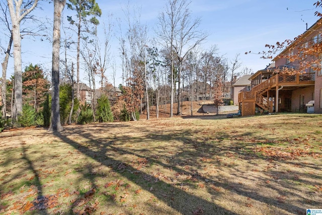 view of yard featuring a wooden deck