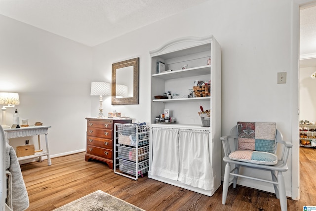 sitting room with hardwood / wood-style floors