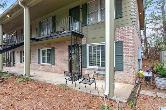 view of side of home with a patio