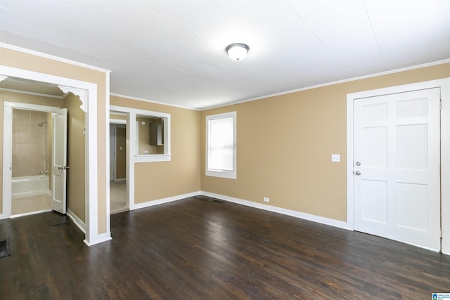 interior space featuring ornamental molding and dark wood-type flooring