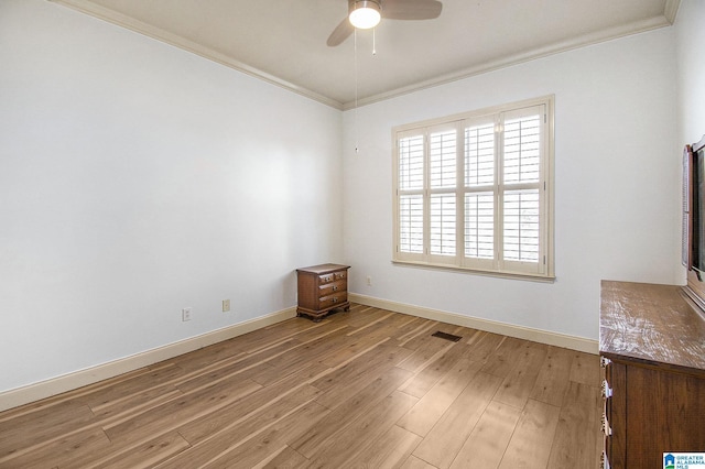 unfurnished room featuring ceiling fan, light hardwood / wood-style floors, and ornamental molding