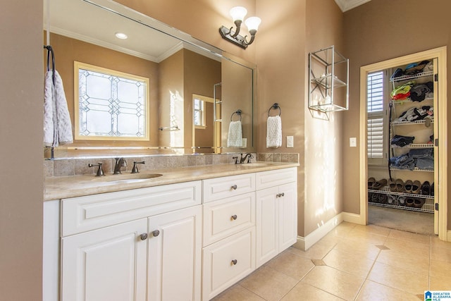 bathroom with tile patterned flooring, vanity, and ornamental molding