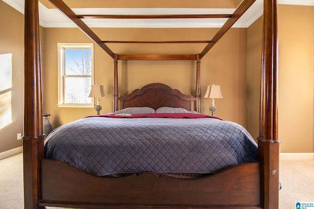 carpeted bedroom featuring crown molding