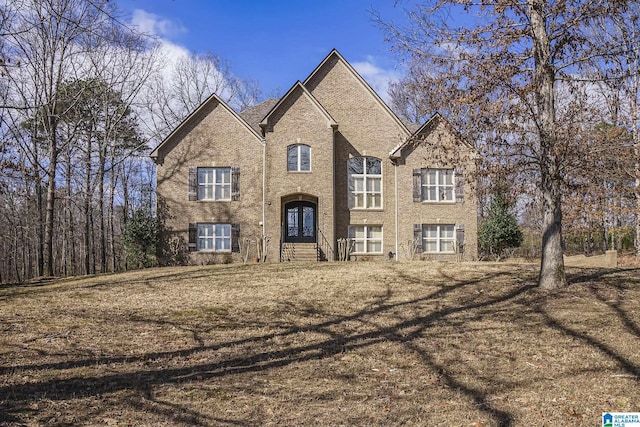 view of front of house featuring brick siding