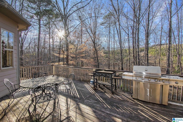 wooden terrace featuring grilling area