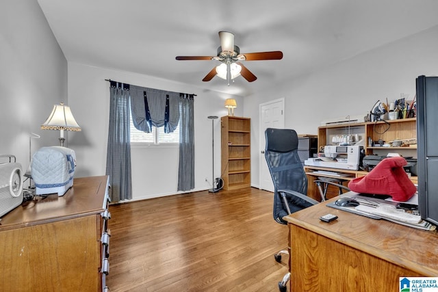 office space featuring ceiling fan and hardwood / wood-style flooring