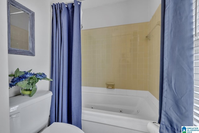 bathroom featuring toilet and shower / tub combo with curtain