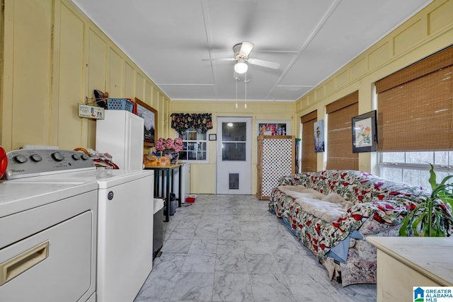 interior space with washer and dryer, ceiling fan, and cabinets