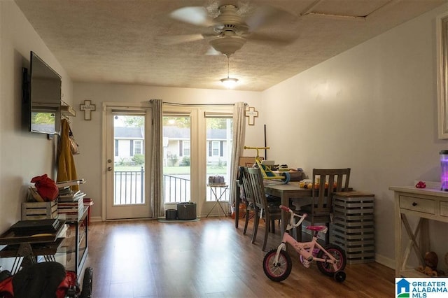 dining area with ceiling fan and hardwood / wood-style flooring