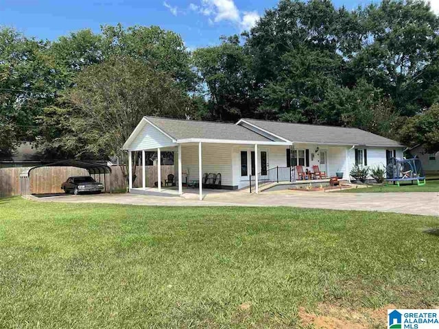 single story home with a porch, a carport, and a front lawn