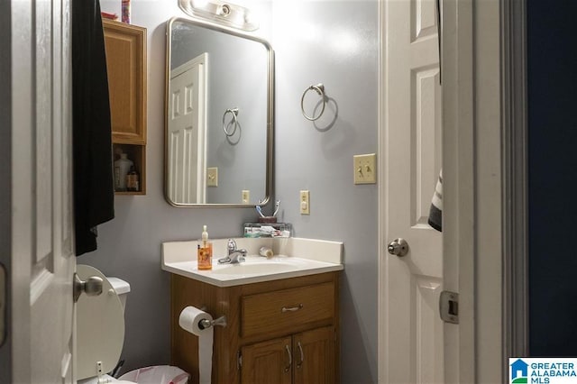 bathroom with vanity and toilet