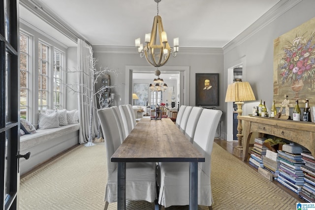 dining space featuring crown molding and an inviting chandelier