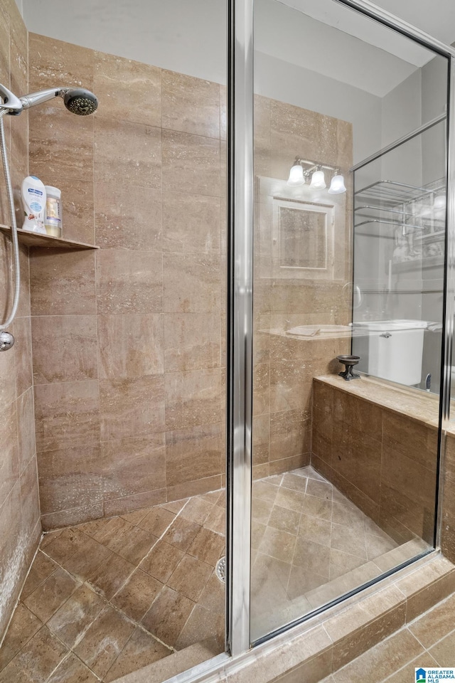 bathroom with a shower with shower door