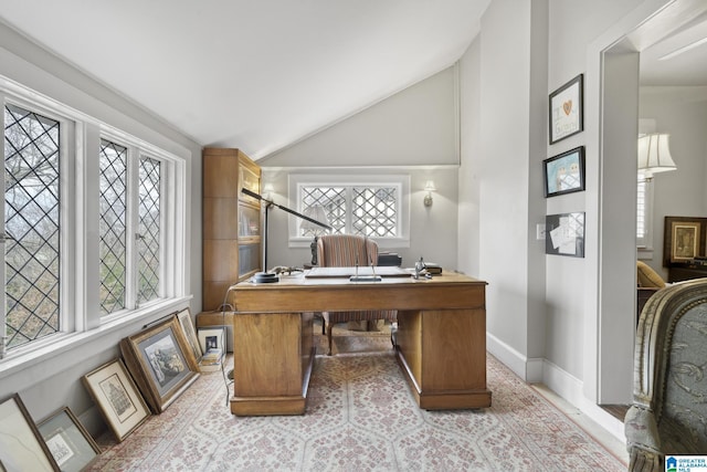 office area with a healthy amount of sunlight and lofted ceiling