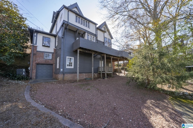 exterior space with a balcony and a garage