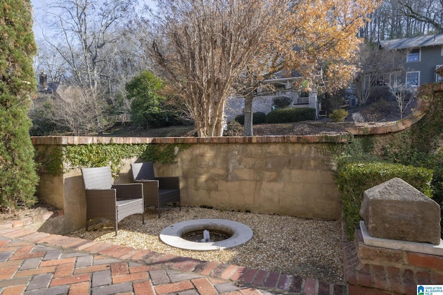 view of patio featuring an outdoor fire pit