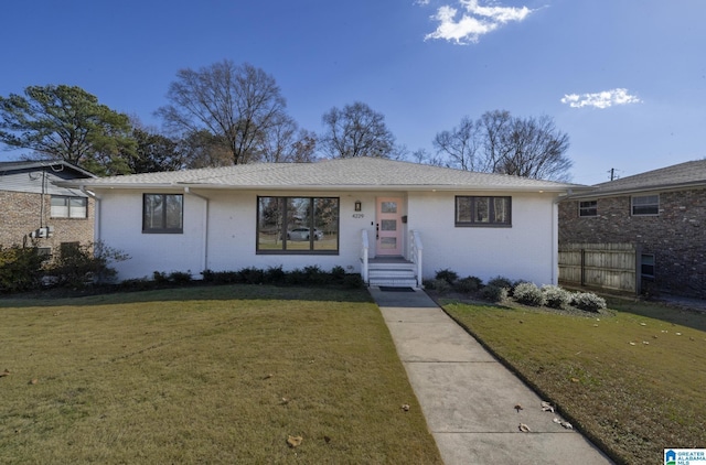 single story home with a front yard