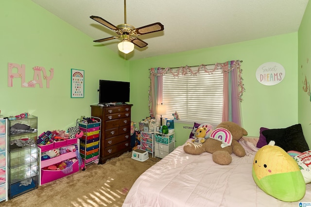 carpeted bedroom with vaulted ceiling and ceiling fan