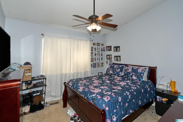 bedroom featuring ceiling fan and light colored carpet