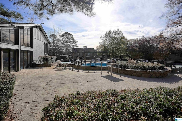 view of pool featuring a patio area