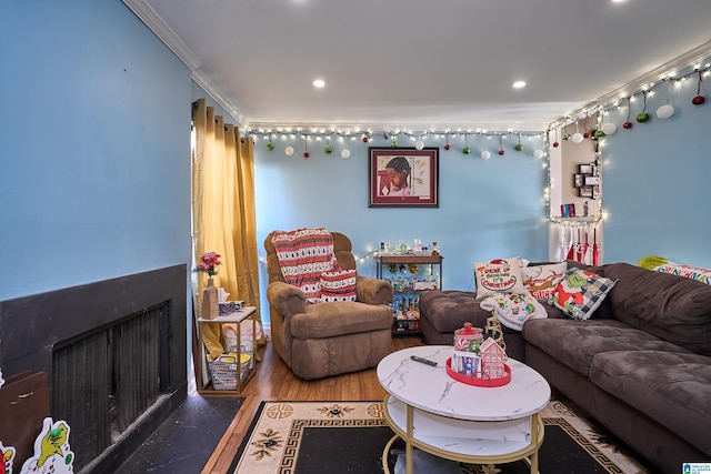 living room with crown molding and wood-type flooring