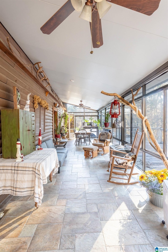 view of patio with outdoor dining area and a ceiling fan