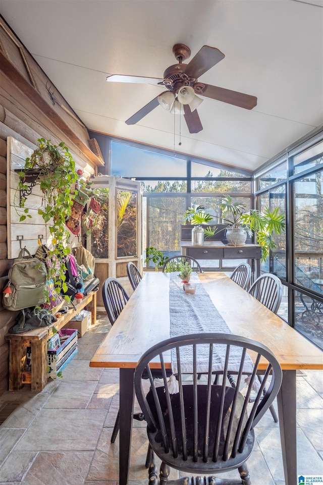 sunroom / solarium with ceiling fan and lofted ceiling