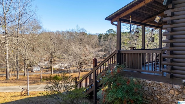 wooden terrace with a porch