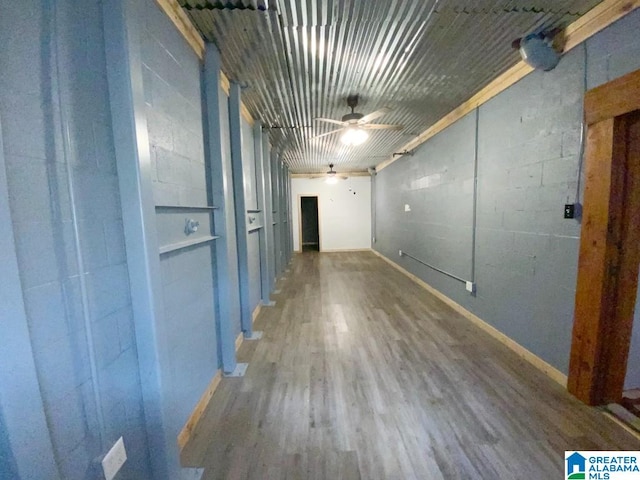 interior space with wood finished floors and baseboards