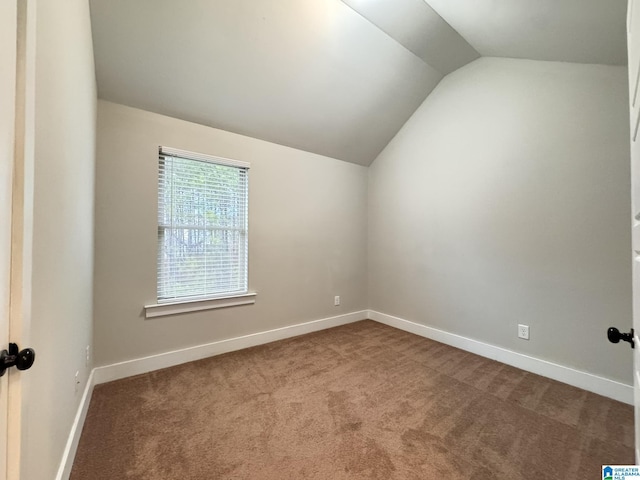 bonus room featuring carpet flooring and vaulted ceiling