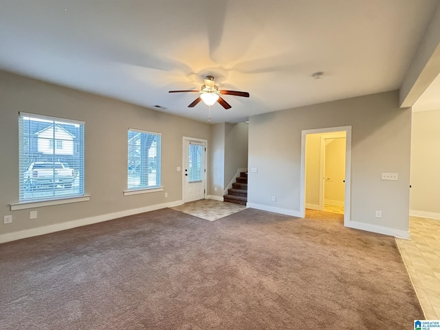 interior space featuring ceiling fan