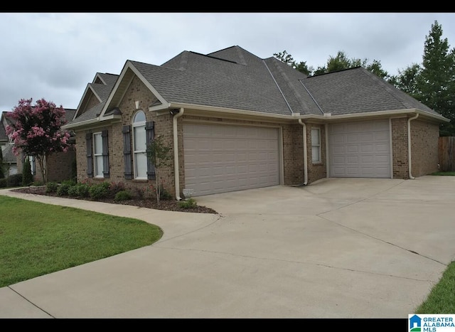 view of side of property with a garage