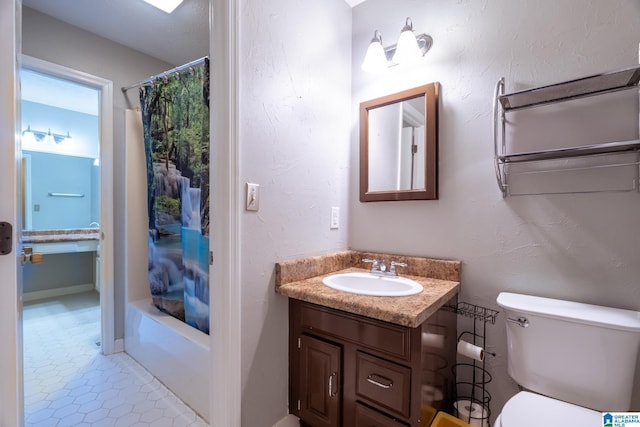 full bathroom featuring tile patterned floors, vanity, toilet, and shower / bath combo with shower curtain