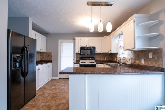 kitchen featuring kitchen peninsula, sink, black appliances, pendant lighting, and white cabinets