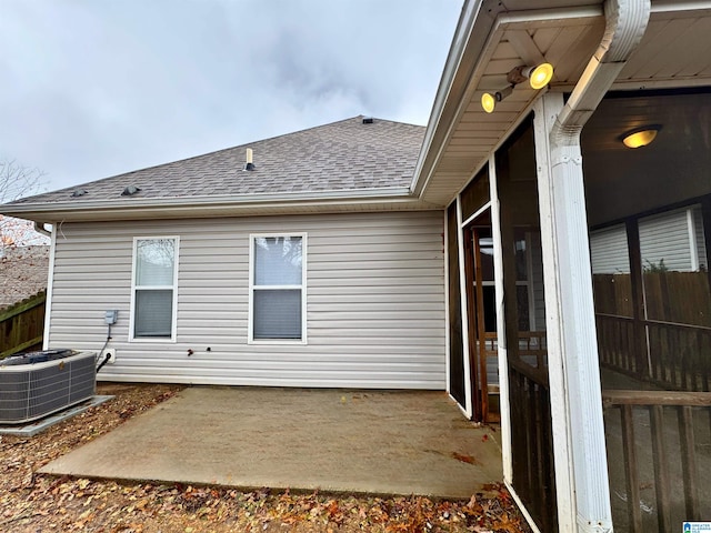 back of house with cooling unit and a patio