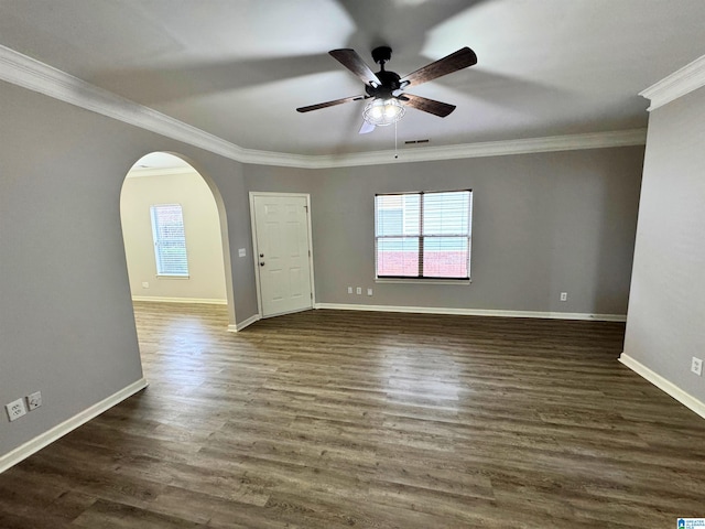 unfurnished room featuring ceiling fan, ornamental molding, and dark wood-type flooring