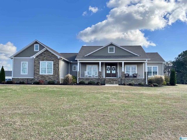 craftsman-style house featuring a front lawn and covered porch