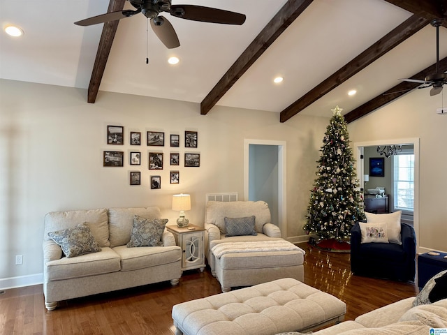 living room with lofted ceiling with beams, ceiling fan, and dark wood-type flooring