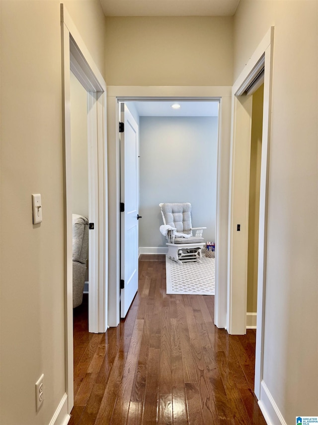 hallway with dark wood-type flooring