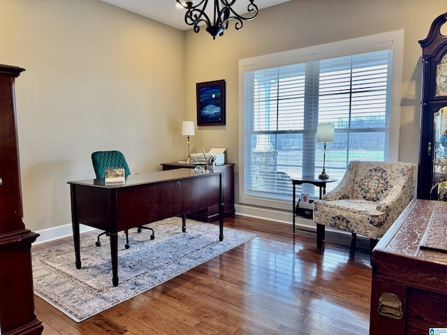 office area with a notable chandelier and wood-type flooring