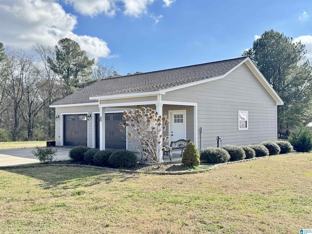 exterior space with a garage and a front yard